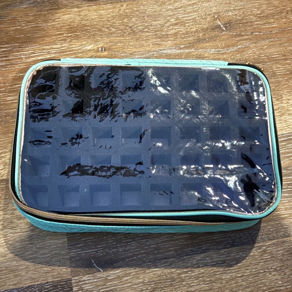 Teal essential oil or nail polish organizer